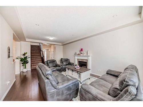 158 Windridge Road Sw, Airdrie, AB - Indoor Photo Showing Living Room With Fireplace