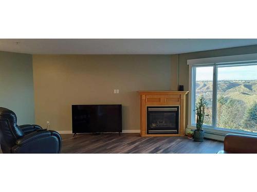 331-100 2 Avenue South, Lethbridge, AB - Indoor Photo Showing Living Room With Fireplace