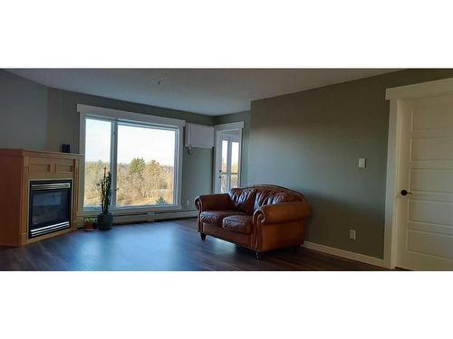 331-100 2 Avenue South, Lethbridge, AB - Indoor Photo Showing Living Room With Fireplace