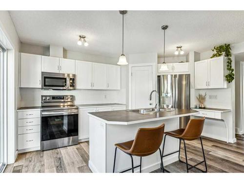 82 New Brighton Green Se, Calgary, AB - Indoor Photo Showing Kitchen With Stainless Steel Kitchen With Double Sink With Upgraded Kitchen