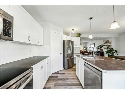 82 New Brighton Green Se, Calgary, AB - Indoor Photo Showing Kitchen With Stainless Steel Kitchen With Double Sink With Upgraded Kitchen