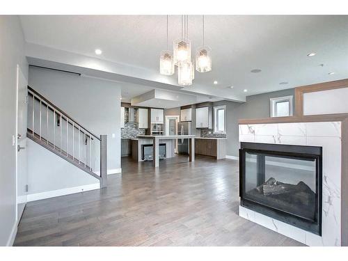 317 15 Avenue Ne, Calgary, AB - Indoor Photo Showing Living Room With Fireplace