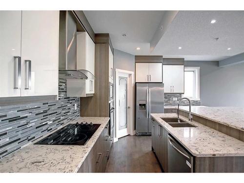 317 15 Avenue Ne, Calgary, AB - Indoor Photo Showing Kitchen With Double Sink With Upgraded Kitchen