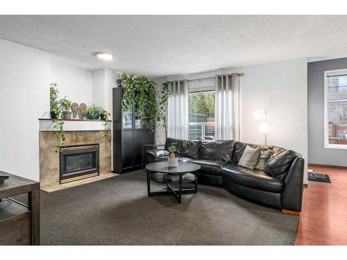 278 Panorrama Hills Lane Nw, Calgary, AB - Indoor Photo Showing Living Room With Fireplace