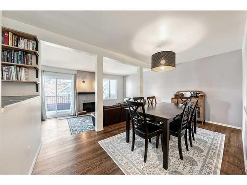 203 37 Street Nw, Calgary, AB - Indoor Photo Showing Dining Room With Fireplace