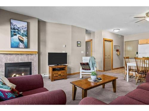 204-107 Montane Road, Canmore, AB - Indoor Photo Showing Living Room With Fireplace