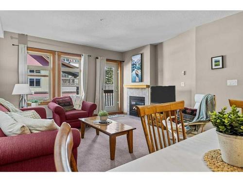 204-107 Montane Road, Canmore, AB - Indoor Photo Showing Living Room With Fireplace