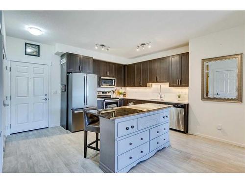 7403-151 Legacy Main Street Se, Calgary, AB - Indoor Photo Showing Kitchen With Stainless Steel Kitchen