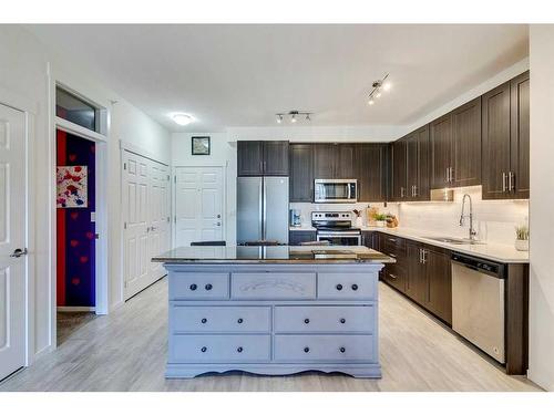 7403-151 Legacy Main Street Se, Calgary, AB - Indoor Photo Showing Kitchen With Stainless Steel Kitchen