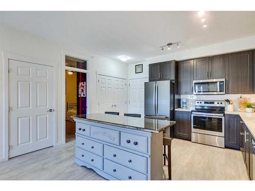 7403-151 Legacy Main Street Se, Calgary, AB - Indoor Photo Showing Kitchen With Stainless Steel Kitchen