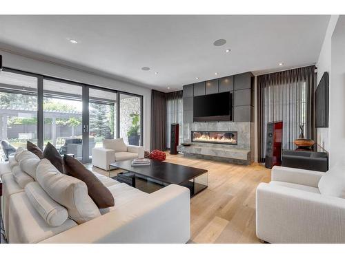 4248 Britannia Drive Sw, Calgary, AB - Indoor Photo Showing Living Room With Fireplace