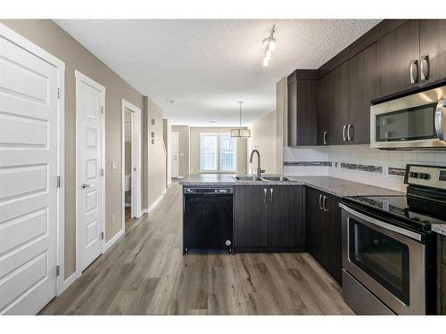 74 Auburn Bay Link Se, Calgary, AB - Indoor Photo Showing Kitchen With Double Sink With Upgraded Kitchen