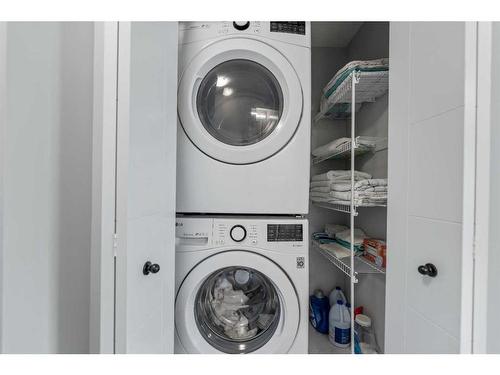 211 South Point Park Sw, Airdrie, AB - Indoor Photo Showing Laundry Room