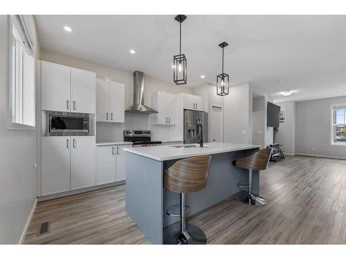 211 South Point Park Sw, Airdrie, AB - Indoor Photo Showing Kitchen With Upgraded Kitchen