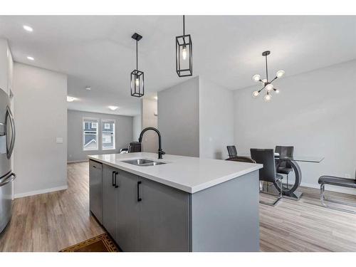 211 South Point Park Sw, Airdrie, AB - Indoor Photo Showing Kitchen With Double Sink With Upgraded Kitchen