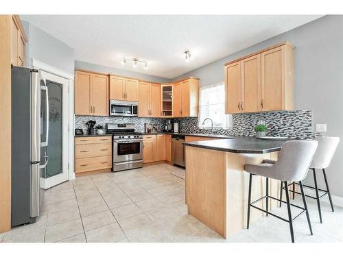 115 Railway Crescent Se, Langdon, AB - Indoor Photo Showing Kitchen With Stainless Steel Kitchen