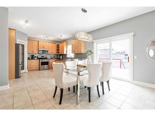 115 Railway Crescent Se, Langdon, AB - Indoor Photo Showing Dining Room