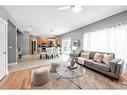 115 Railway Crescent Se, Langdon, AB  - Indoor Photo Showing Living Room 