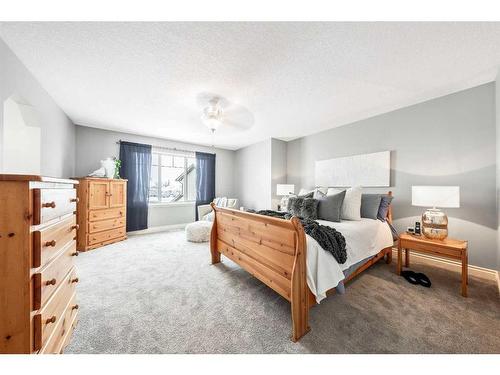 115 Railway Crescent Se, Langdon, AB - Indoor Photo Showing Bedroom