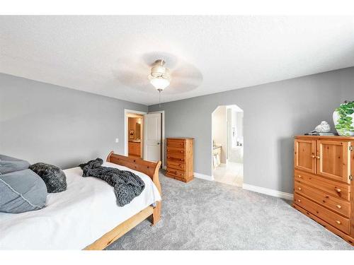 115 Railway Crescent Se, Langdon, AB - Indoor Photo Showing Bedroom