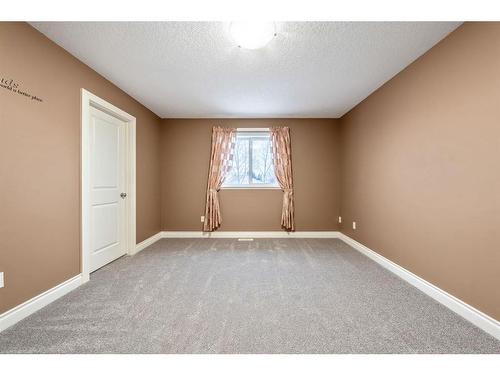 115 Railway Crescent Se, Langdon, AB - Indoor Photo Showing Other Room