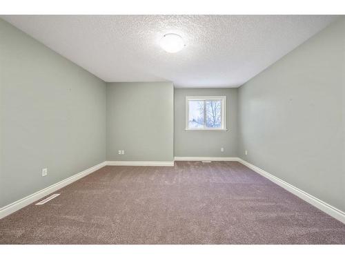 115 Railway Crescent Se, Langdon, AB - Indoor Photo Showing Other Room