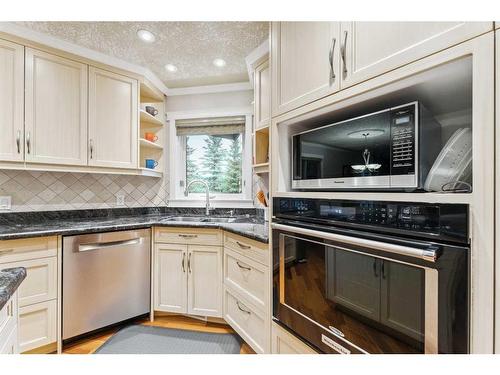 143 Christie Knoll Heights Sw, Calgary, AB - Indoor Photo Showing Kitchen With Double Sink