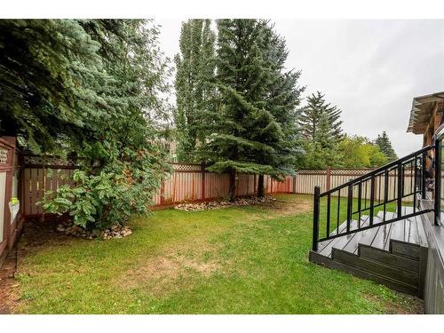 143 Christie Knoll Heights Sw, Calgary, AB - Outdoor With Backyard