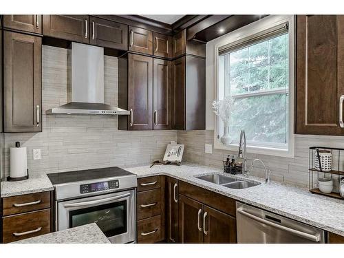 18 Discovery Heights Sw, Calgary, AB - Indoor Photo Showing Kitchen With Stainless Steel Kitchen With Double Sink With Upgraded Kitchen