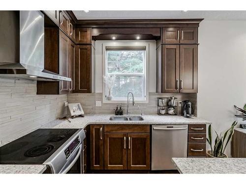 18 Discovery Heights Sw, Calgary, AB - Indoor Photo Showing Kitchen With Stainless Steel Kitchen With Double Sink