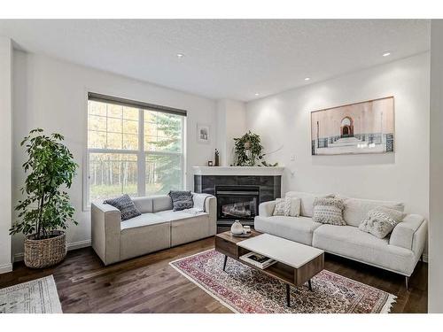 18 Discovery Heights Sw, Calgary, AB - Indoor Photo Showing Living Room With Fireplace