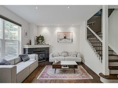 18 Discovery Heights Sw, Calgary, AB - Indoor Photo Showing Living Room With Fireplace