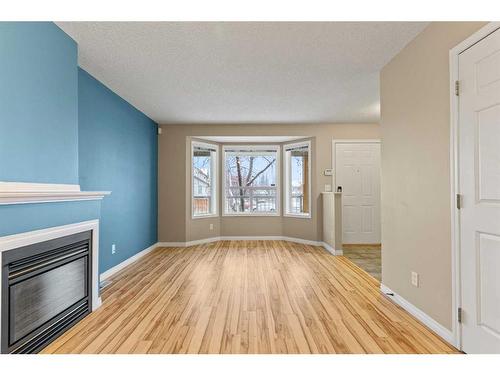 9 Hidden Valley Villas Nw, Calgary, AB - Indoor Photo Showing Other Room With Fireplace