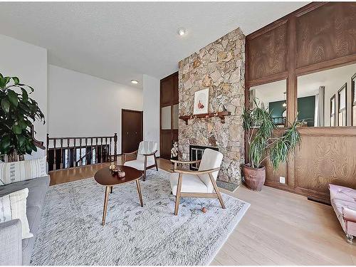 83 Berwick Crescent Nw, Calgary, AB - Indoor Photo Showing Living Room With Fireplace