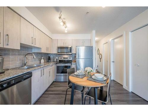 2317-4641 128 Avenue Ne, Calgary, AB - Indoor Photo Showing Kitchen With Double Sink