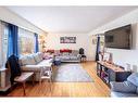 121 Holmwood Avenue Nw, Calgary, AB  - Indoor Photo Showing Living Room 