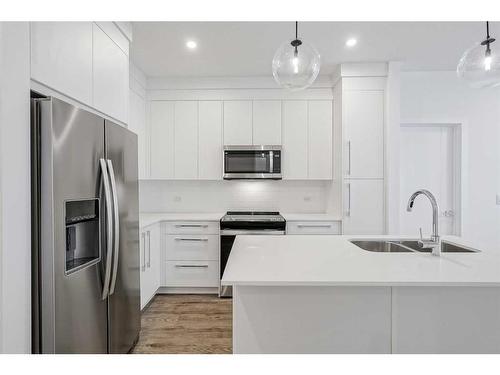 4307-111 Wolf Creek Drive Se, Calgary, AB - Indoor Photo Showing Kitchen With Double Sink With Upgraded Kitchen