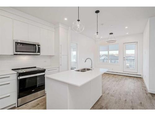 4307-111 Wolf Creek Drive Se, Calgary, AB - Indoor Photo Showing Kitchen With Double Sink With Upgraded Kitchen