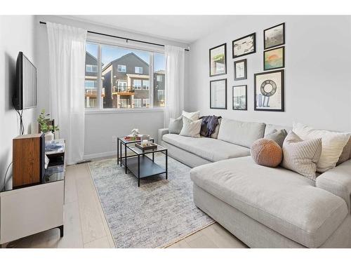 57 Edith Gate Nw, Calgary, AB - Indoor Photo Showing Living Room