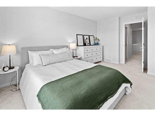 57 Edith Gate Nw, Calgary, AB - Indoor Photo Showing Bedroom