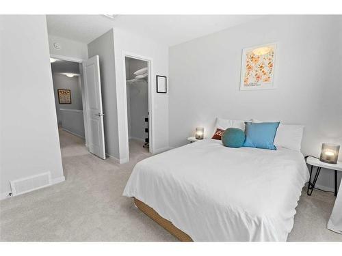 57 Edith Gate Nw, Calgary, AB - Indoor Photo Showing Bedroom