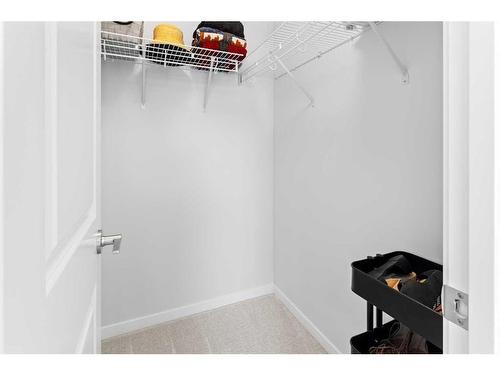 57 Edith Gate Nw, Calgary, AB - Indoor With Storage