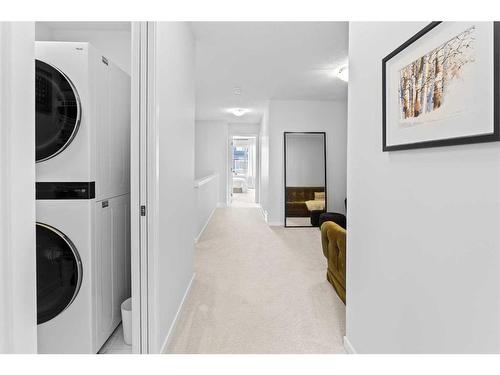 57 Edith Gate Nw, Calgary, AB - Indoor Photo Showing Laundry Room