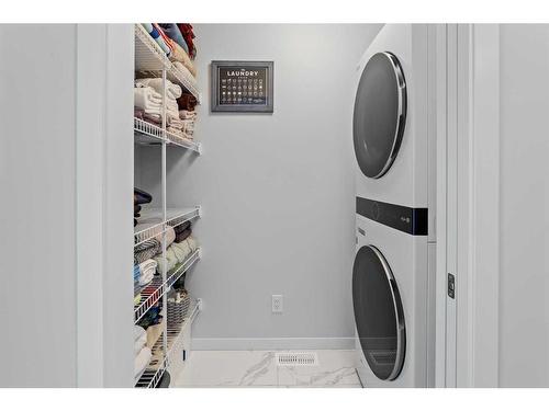 57 Edith Gate Nw, Calgary, AB - Indoor Photo Showing Laundry Room