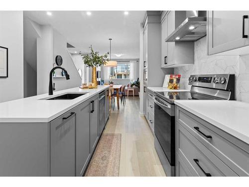 57 Edith Gate Nw, Calgary, AB - Indoor Photo Showing Kitchen With Upgraded Kitchen