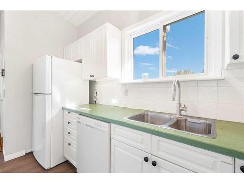 1-10816 5 Street Sw, Calgary, AB - Indoor Photo Showing Kitchen With Double Sink