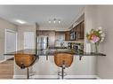 106-76 Panatella Road Nw, Calgary, AB  - Indoor Photo Showing Kitchen With Double Sink 