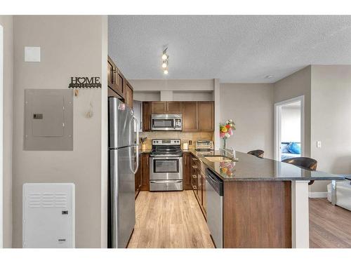 106-76 Panatella Road Nw, Calgary, AB - Indoor Photo Showing Kitchen With Upgraded Kitchen