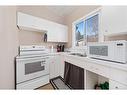 4970 Rundlewood Drive Ne, Calgary, AB  - Indoor Photo Showing Kitchen With Double Sink 