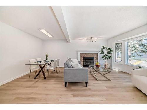 222 Cedarwood Park Sw, Calgary, AB - Indoor Photo Showing Living Room With Fireplace